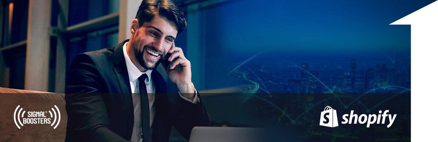 Man in office smiling on phone