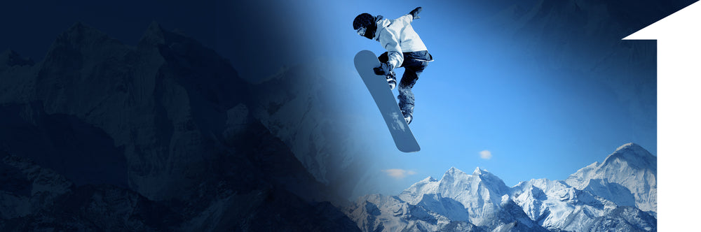 man on snowboard going over mountains | 1HUTCH